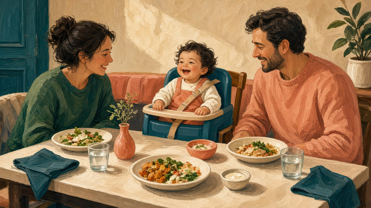 Toddler in a booster seat at the family dinner table